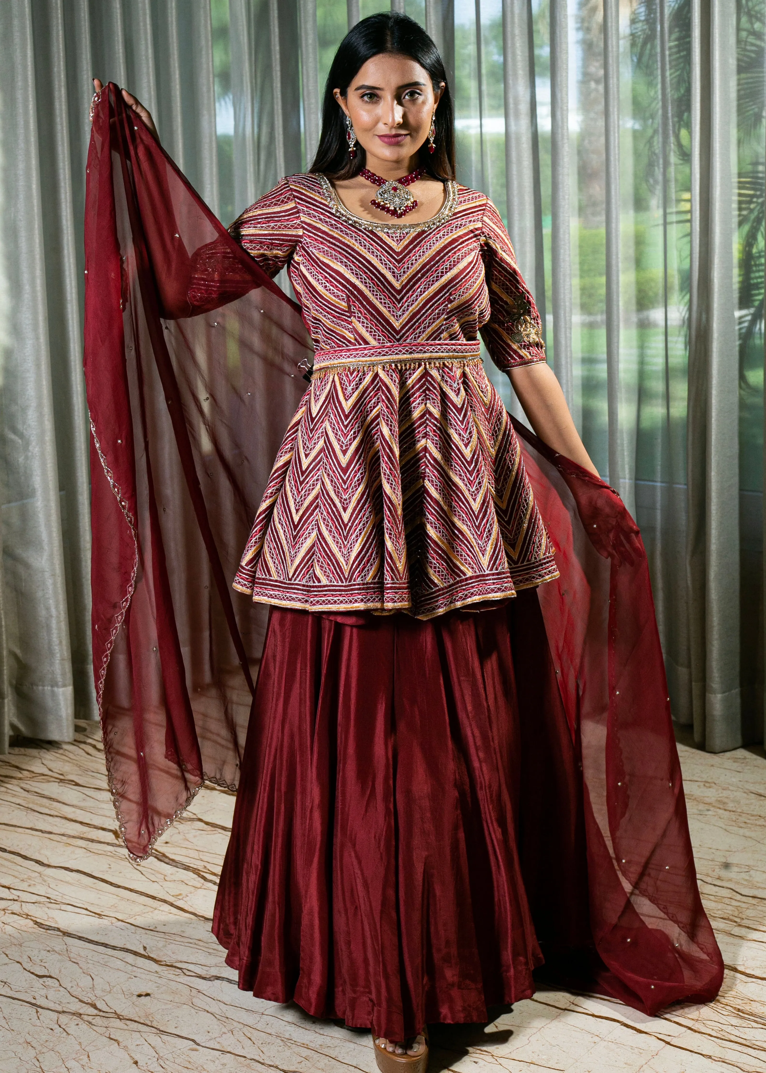 Flared Maroon Silk Lehenga with Intricate Embroidery and Handcrafted Details