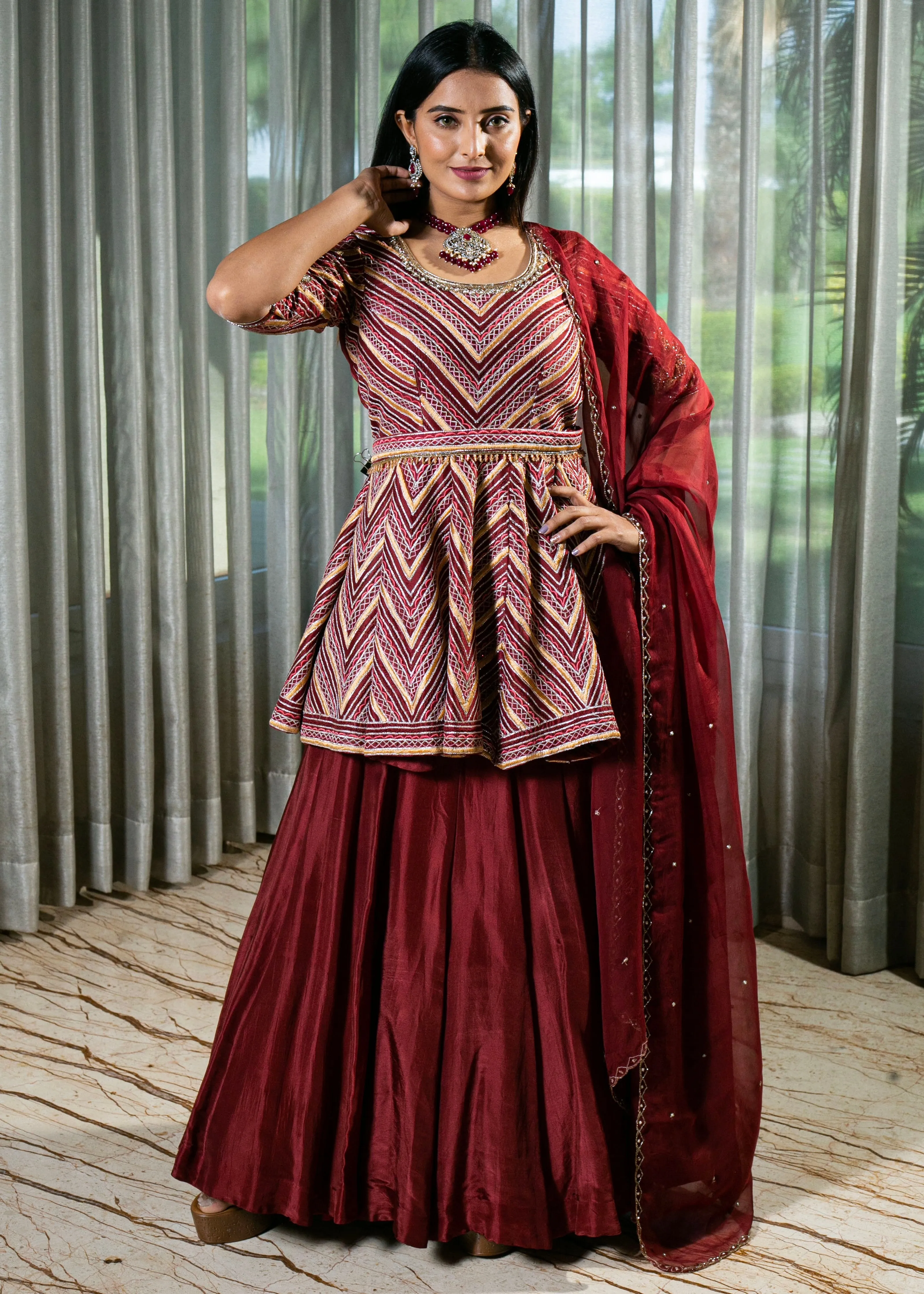 Flared Maroon Silk Lehenga with Intricate Embroidery and Handcrafted Details